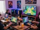 Exciting gaming scene with players engaged in สล็อตเว็บตรง games, showcasing a vibrant atmosphere with consoles and snacks.